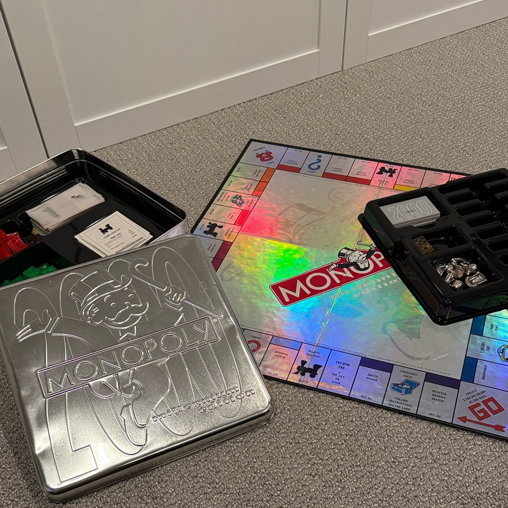 Monopoly Millenium Edition Board Game with Silver Tin